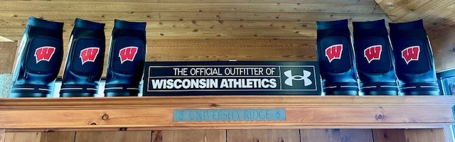 Den caddies next to an Underarmor sponsor message